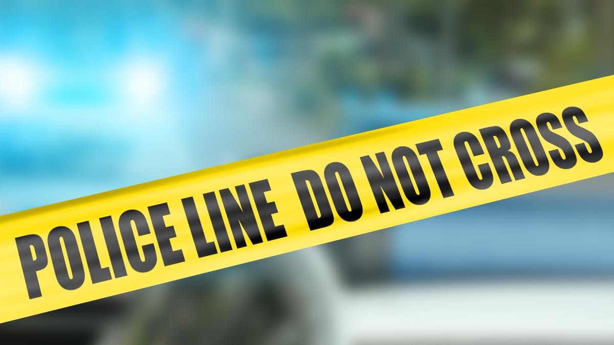 Yellow tape that says police line do not cross.