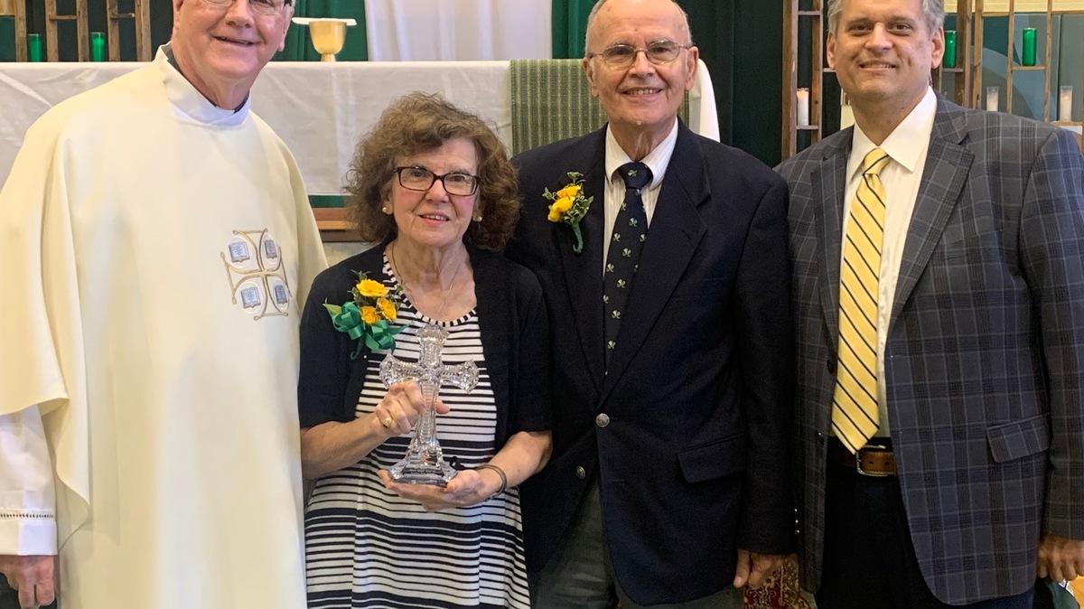 From left are Ursuline President Rev. Richard Murphy ('72), Maria Kregar Selak ('68), August Selak ('67) and Principal Matthew Sammartino. The Selaks were recently presented Distinguished Alumni Awards.