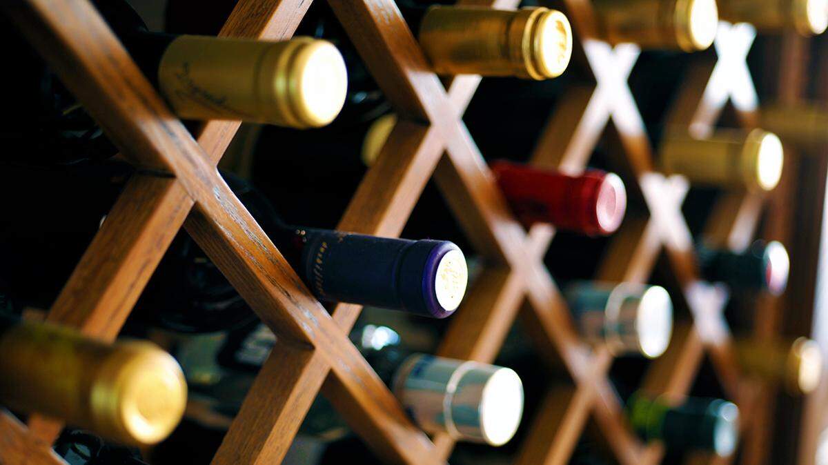A wine rack featuring several bottles.