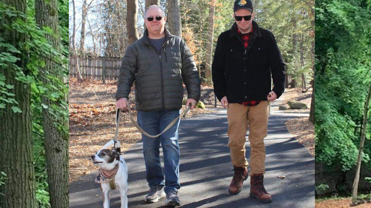 MetroMutts member Michael Freeman and his dog, Ruby walking on new East Park hike and bike trail.