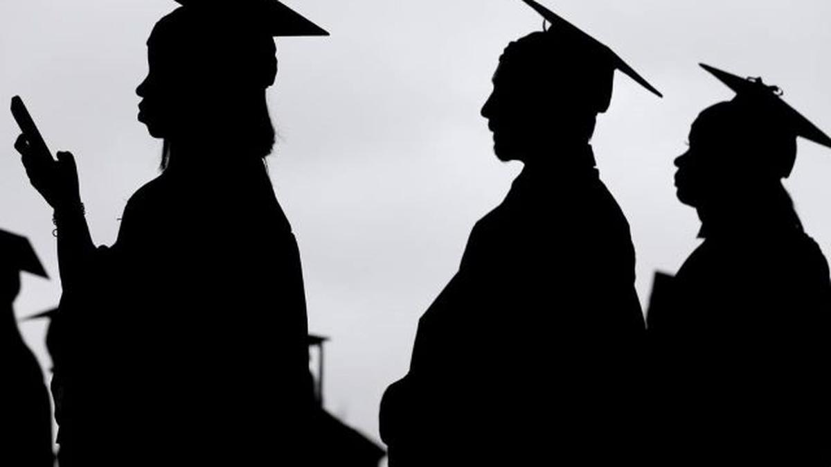 In this May 17, 2018, file photo, new graduates line up before the start of the Bergen Community College commencement at MetLife Stadium in East Rutherford, N.J. (Seth Wenig | AP Photo, File)