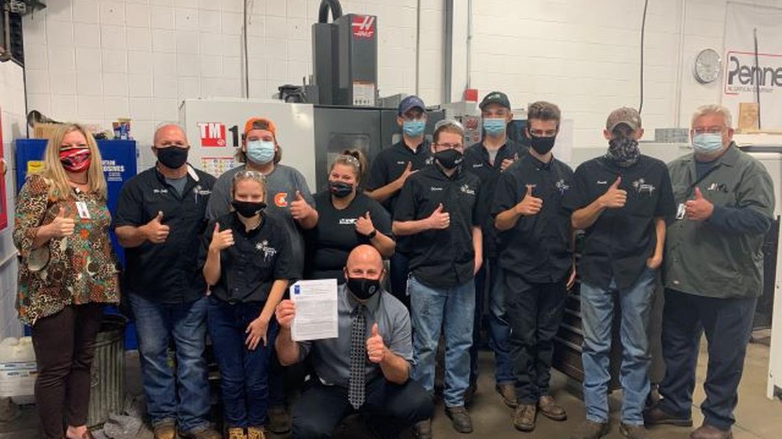 The Advanced Manufacturing program at the Mahoning County Career and Technical Center has received a grant from the Gene Haas Foundation. Pictured, from left, are Mara Banfield, MCCTC director; Mike Lutz, Advanced Manufacturing instructor; Megan Christoff of Canfield; Matt Campbell, MCCTC principal; Nick Bilas of Springfield; Brandi Smith of Struthers; David Pollo of Boardman; Matthew Fleming of West Branch; Jonah Mitchell of Austintown; Bryce Schmid of Poland; Colin Smith of Austintown; and Larry McDevitt, MCCTC paraprofessional. (Contributed photo)