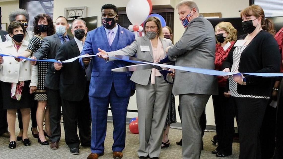 Jeffrey Magada, founder and executive director of Flying HIGH Inc., cuts the ribbon to mark the opening of the Job Placement Welcome Center on Tuesday at 6 Federal Plaza. (Ellen Wagner | Mahoning Matters)