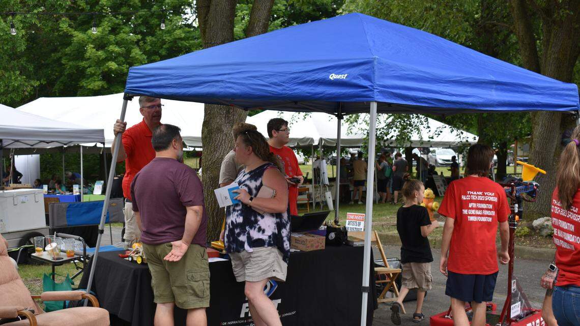Attendees gather under a tent at Riverfest in Youngstown.