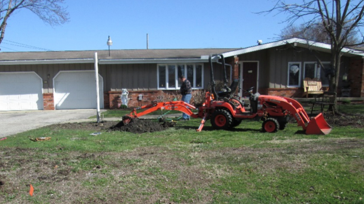 Homeowners in Ashtabula County excavate the Kray #1 orphan well in their front lawn four years after they began smelling leaking gas. (Photo Courtesy of Ohio Department of Natural Resources)