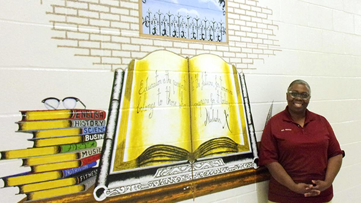 Natalie Grant-Askew, instruction supervisor for Northeast Ohio Correctional Center's college program for inmates, provided by Ohio's Ashland University, poses inside the prison's education center. (Photo provided)