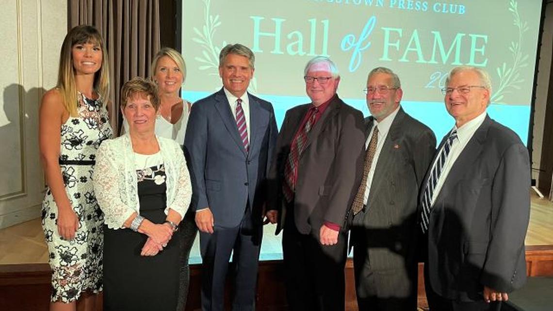 From left, late 21 WFMJ-TV anchor Bob Black’s family — daughter Molly, widow Coleen and daughter Lindsay; 27 WKBN-TV anchor Stan Boney; emcee and Business Journal reporter George Nelson; Ralph Zerbonia, who founded Youngstown Publishing Co.; and Dennis Mangan, former Vindicator Editorial Page editor. Bob Black, Boney and Zerbonia were inducted into the Youngstown Press Club Hall of Fame during a ceremony Wednesday at Stambaugh Auditorium. The Vindicator Printing Co. received the inaugural First Amendment Award. (Robert K. Yosay | Mahoning Matters)