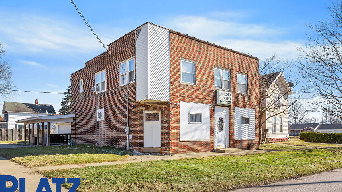 There’s an outdoor patio and second-story apartment at the property at 231 North Center St. available for $100,000.