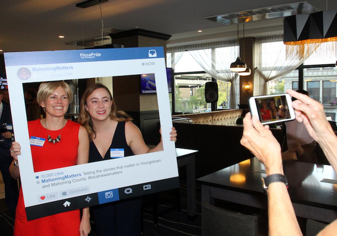GM/Publisher Mandy Jenkins and reporter Jess Hardin try out the Instagram frame at the Mahoning Matters launch party at the DoubleTree Hotel.
