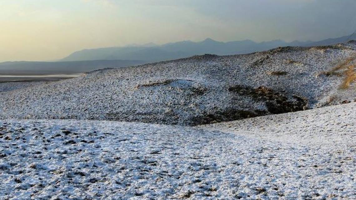 Photo of a snow-like dusting at Death Valley National Park in California was caused by rain soaking into the soil and dissolving salt beneath the surface, rangers said. (M. Gage | National Park Service)