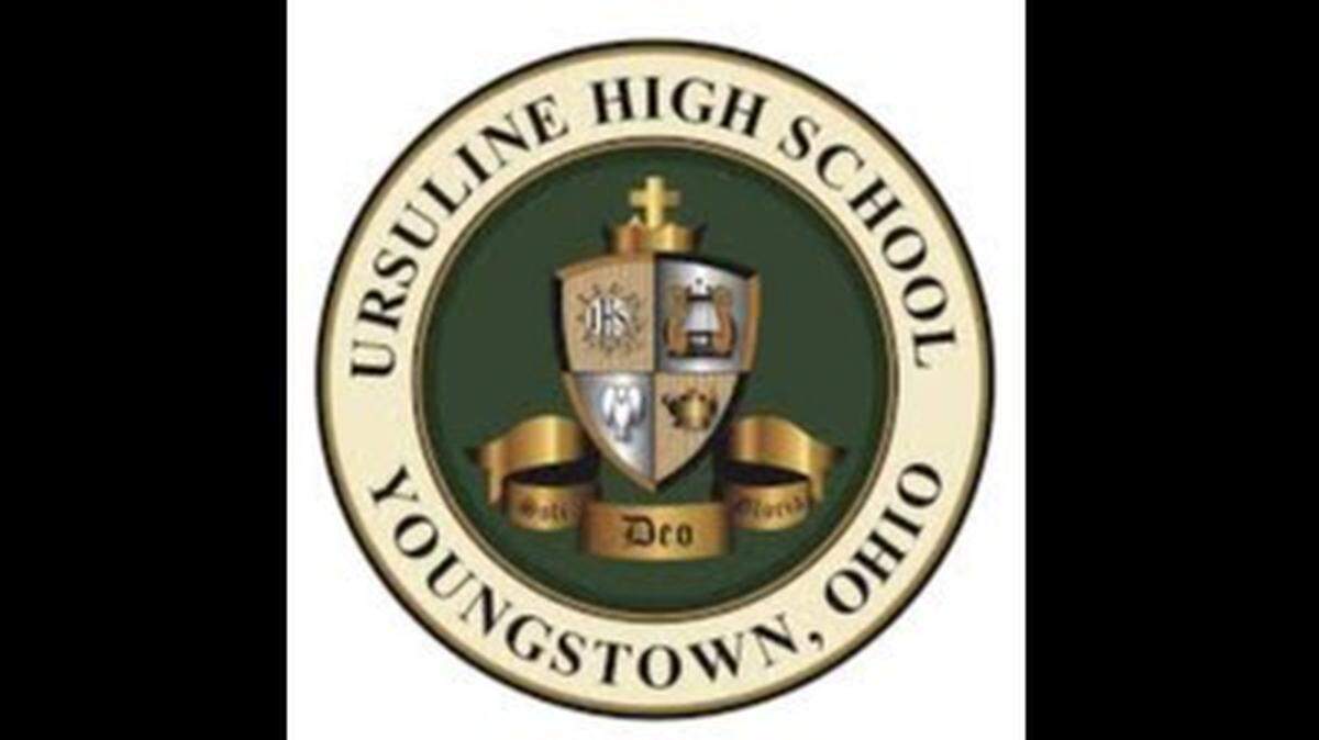 Ursuline President Father Richard Murphy distributes letter to school parents, students.