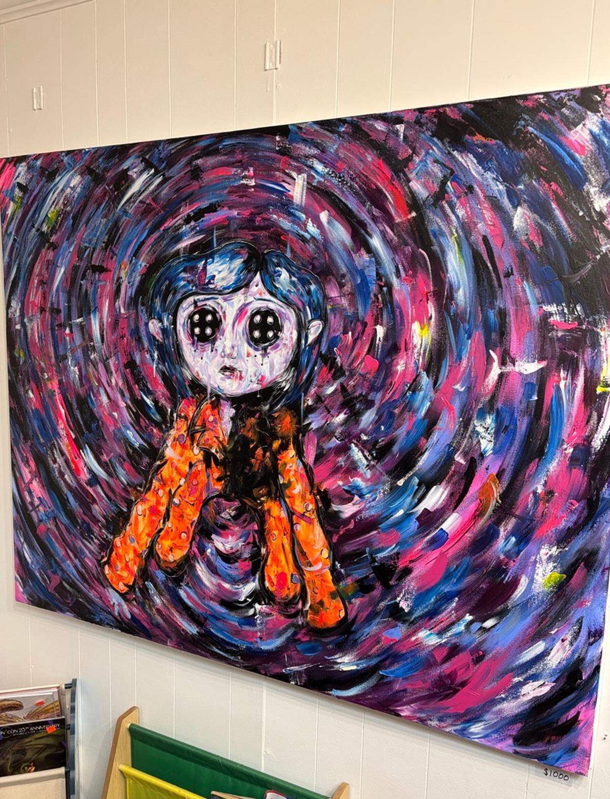 Local artist Jennuhlee’s painting of Coraline inside POP Art Books Culture in Boardman