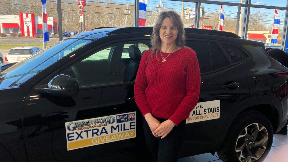 Youngstown resident Carol Michaels with her new car.